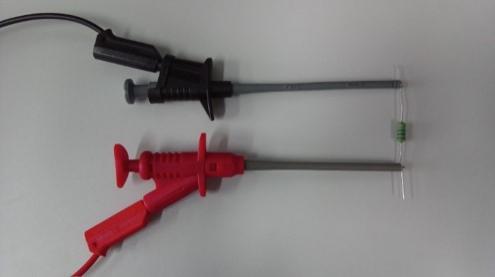Test leads with clips on a resistor